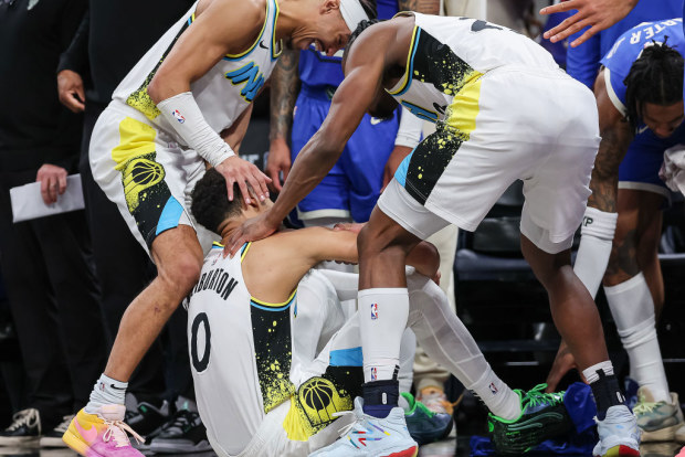 Andrew Nembhard #2 and Aaron Nesmith #23 of the Indiana Pacers celebrate with Tyrese Haliburton #0 after he scores a last-minute three-pointer against the Milwaukee Bucks.