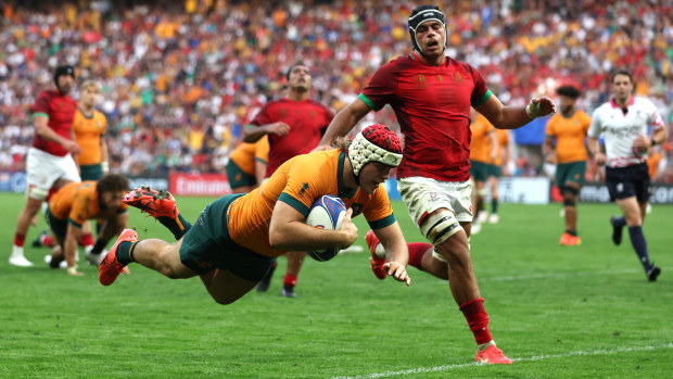 Fraser McReight of Australia scores his team's fourth try.