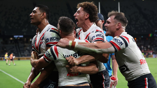 Daniel Tupou receives congratulations from teammates after a crucial tackle on Brian To'o.