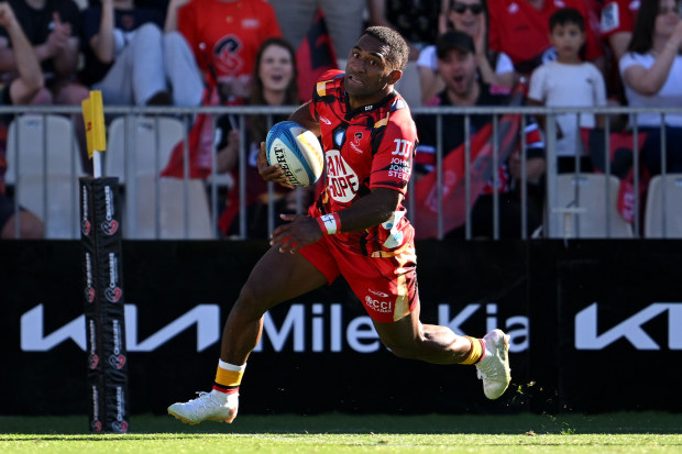 Sevu Reece of the Crusaders charges over the try line to score his second.