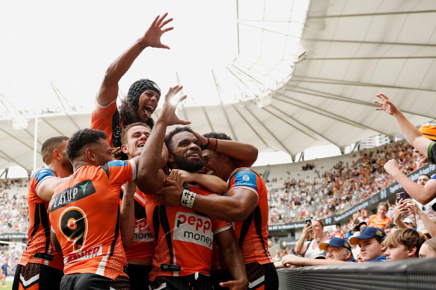 Wests Tigers celebrate a try in their thumping win over the Eels.