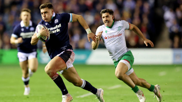 Tom Jordan of Scotland runs with the ball.
