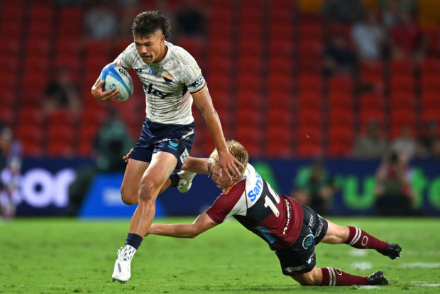 Kyren Taumoefolau of Moana Pasifika making a break before scoring a try.
