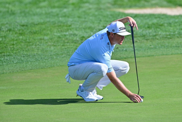 Patton Kizzire of the United States lines up a putt on the 15th green.