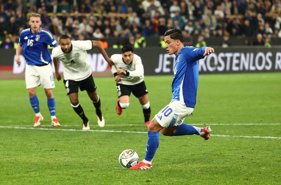 Giacomo Raspadori scores Italy's third goal from the penalty spot on Sunday