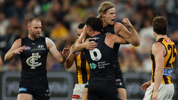 Tom De Koning from Carlton celebrates a goal with teammate Zac Williams.