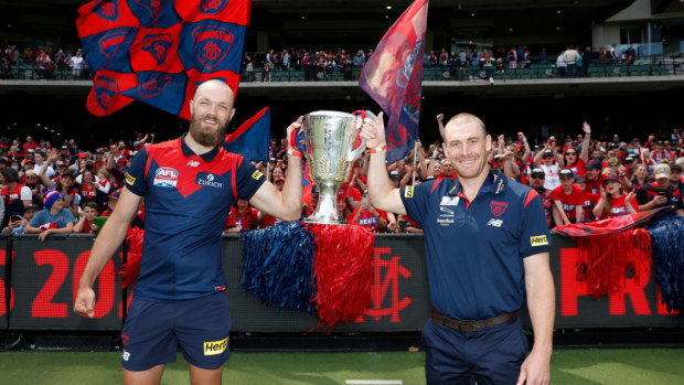 Max Gawn and Simon Goodwin hold the cup aloft in 2021.