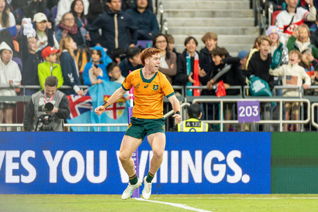 Sidney Harvey of Australia celebrates his try.