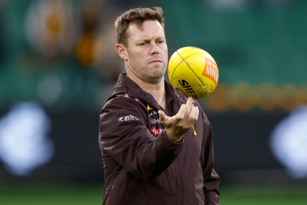 Sam Mitchell, Senior Coach of the Hawks observing. 