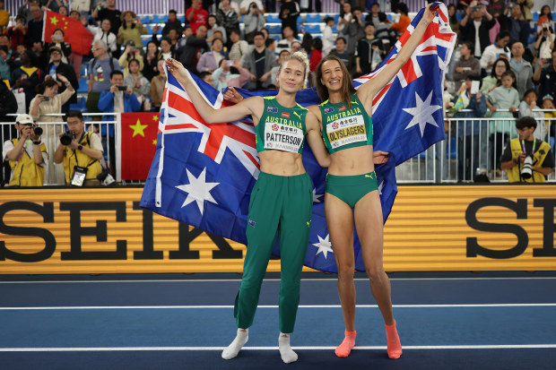 Silver medallist Eleanor Patterson (left) and gold medallist Nicola Olyslagers celebrate at the world athletics indoor championships.