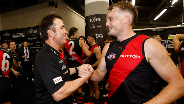 Brad Scott celebrates his club's win over Port Adelaide with defender Mason Redman