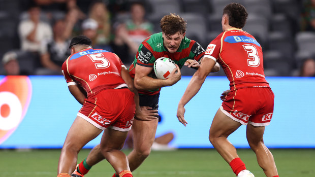 Campbell Graham of South Sydney is tackled during the round one NRL match between the Dolphins and the Rabbitohs.