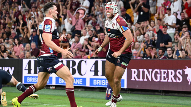 Fraser McReight of the Reds celebrates after scoring a try.