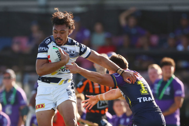 Jeremiah Nanai of the Cowboys runs with the ball.