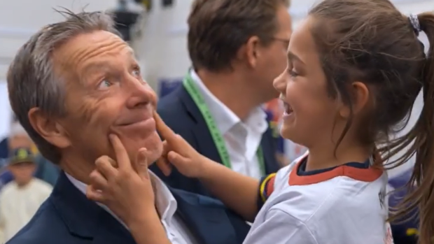 Craig Bellamy with his granddaughter Billie in the sheds after a Melbourne Storm game.