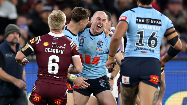 Dylan Edwards of the Blues celebrates with team mates after scoring a try in his debut Origin match.