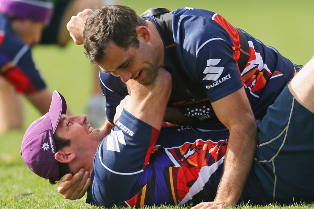 Bryan Norrie and Cameron Smith wrestling during a Melbourne Storm training session.