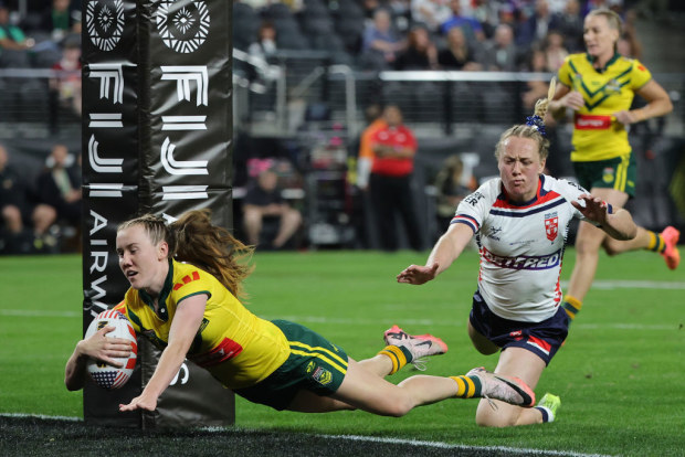 Tamika Upton of Australia scores a try against England.
