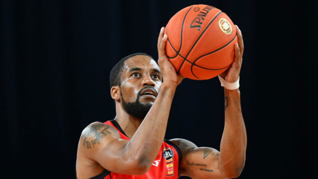 Bryce Cotton of the Wildcats shoots.