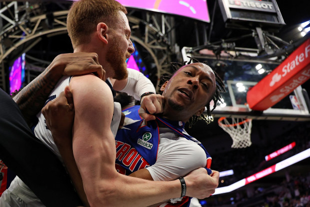 Ronald Holland II #00 of the Detroit Pistons and Donte DiVincenzo #0 of the Minnesota Timberwolves clash in the second quarter. Both were ejected from the game at the Target Center on March 30, 2025 in Minneapolis, Minnesota.