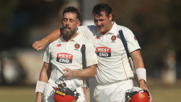 MELBOURNE, AUSTRALIA - MARCH 09: Jake Lehmann of South Australia and Ben Manenti of South Australia embrace after winning the Sheffield Shield match between Victoria and South Australia at CitiPower Centre, on March 09, 2025, in Melbourne, Australia. (Photo by Daniel Pockett/Getty Images)