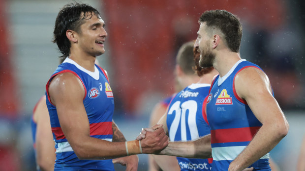Marcus Bontempelli and Jamarra Ugle-Hagan of the Western Bulldogs celebrate a victory.