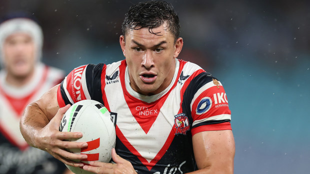 Joseph Manu runs with the ball down the line.