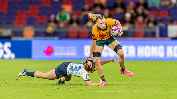 Maddison Levi of Australia runs with the ball.