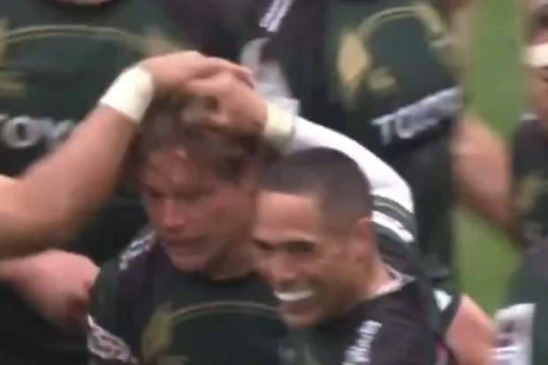 Michael Hooper and Aaron Smith celebrate Hooper's try.