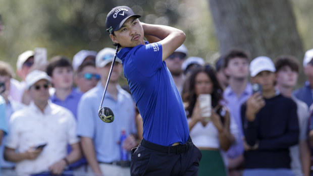 Min Woo Lee plays a tee shot on the ninth hole during the second round of The Players.