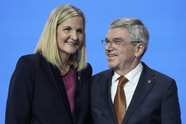 IOC president Thomas Bach, right, greets Kirsty Coventry after she was announced as the new president.