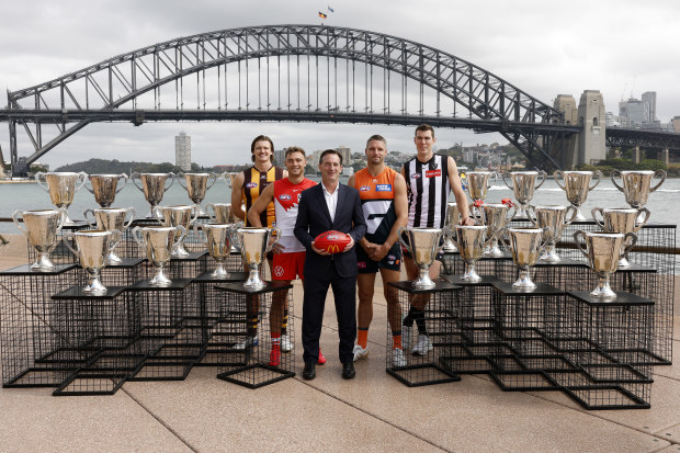 AFL CEO Andrew Dillon poses for a photo with Mitch Lewis of the Hawks, Will Hayward of the Swans, Jesse Hogan of the Giants and Mason Cox of the Magpies during the 2025 AFL Opening Round Launch at Sydney Opera House on March 03, 2025 in Sydney, Australia. (Photo by Darrian Traynor/AFL Photos/via Getty Images)