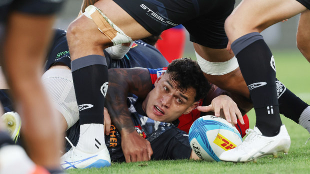 Shaun Stevenson of the Chiefs presents the ball.