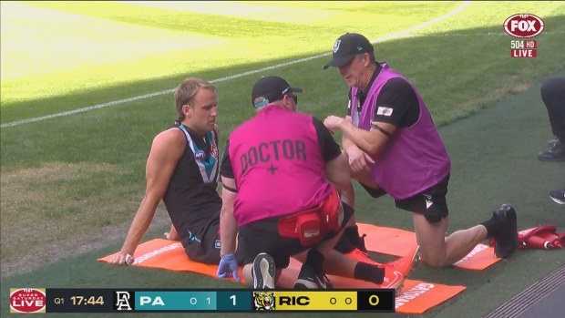 Jack Lukosius receives medical treatment.