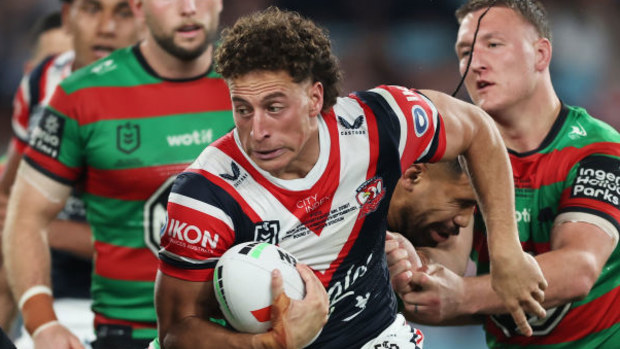 Mark Nawaqanitawase of the Roosters is tackled during the round 27 NRL match.