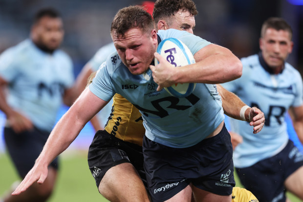 Angus Bell of the Waratahs runs with the ball.