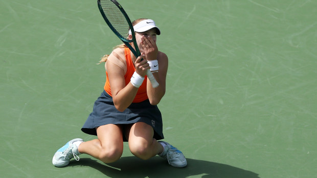 Mirra Andreeva of Russia reacts after winning match point to defeat Aryna Sabalenka.