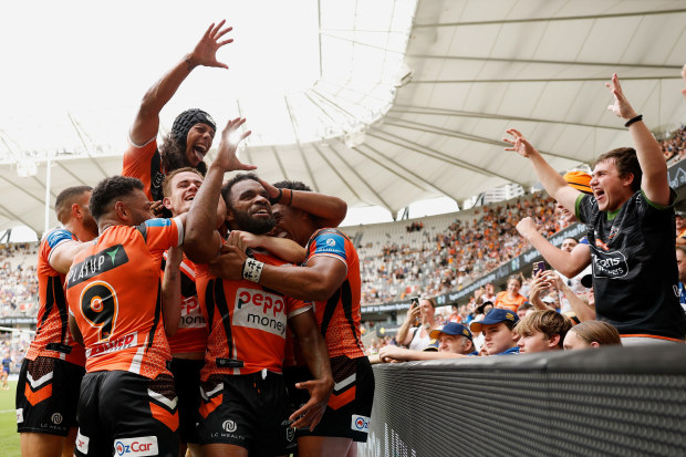 Wests Tigers celebrate a try in their thumping win over the Eels.