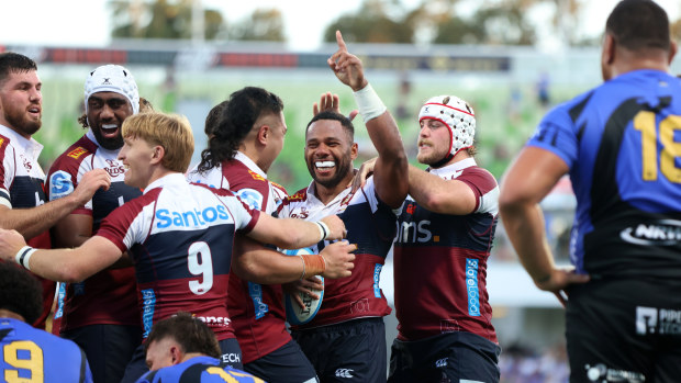 Filipo Daugunu of the Reds celebrates a try.