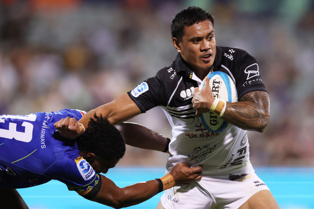 Len Ikitau of the Brumbies is tackled.