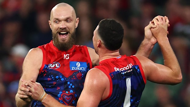 Steven May of the Demons is congratulated by Max Gawn