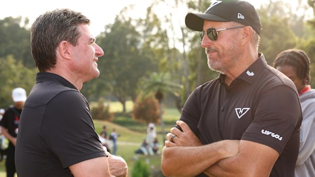 Scott O'Neil, CEO of LIV Golf, engages in conversation with Phil Mickelson from Hyflyers GC following the match on day three of LIV Golf Hong Kong at The Hong Kong Golf Club on March 09, 2025, in Hong Kong, China. (Photo by Zhizhao Wu/Getty Images)