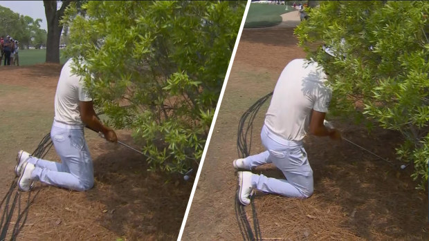 Min Woo Lee practises a shot on his knees on the eighth hole at the Houston Open.