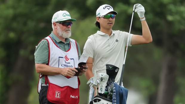 Min Woo Lee of Australia and caddie Brian Martin on the 14th hole during the final round of the Texas Children's Houston Open 2025 at Memorial Park Golf Course on March 30, 2025 in Houston, Texas. (Photo by Jonathan Bachman/Getty Images)