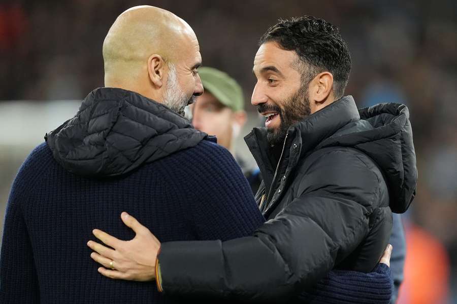Manchester United manager Ruben Amorim (right) embraces Manchester City manager Pep Guardiola ahead of the Premier League match at the Etihad Stadium, Manchester.