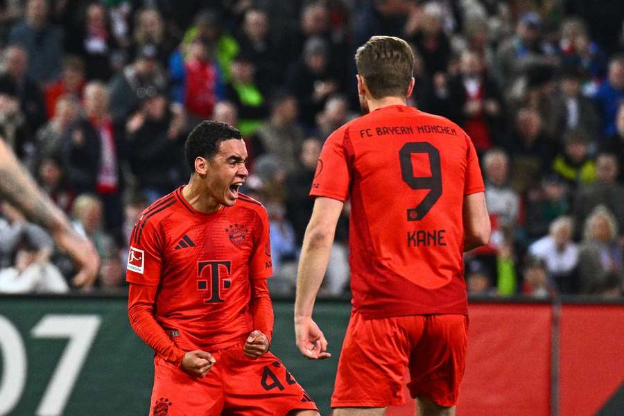 Musiala (L) celebrates his goal