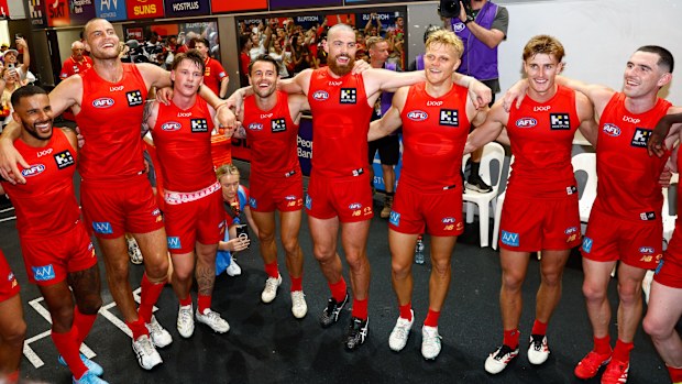 Gold Coast players celebrate their victory over Adelaide.