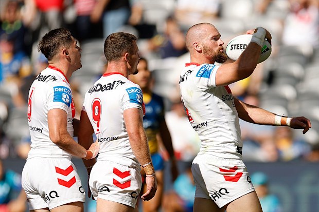 Clint Gutherson of the Dragons celebrates after scoring a try.