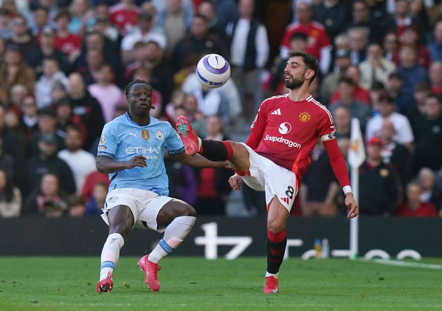 Man City's Jeremy Doku and Man United's Bruno Fernandes