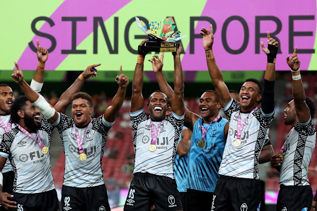 Fiji men's sevens team celebrating their victory at the Singapore Sevens tournament.
